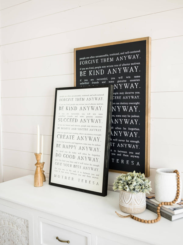 Love them Anyway | Mother Teresa | Wall Art: Soft White-Black Text / Light Brown Frame / 8 inches x 12 inches
