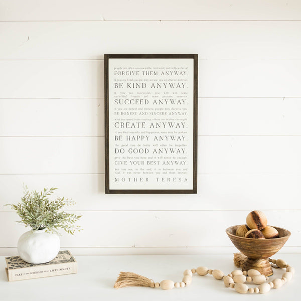Love them Anyway | Mother Teresa | Wall Art: Soft White-Black Text / Light Brown Frame / 8 inches x 12 inches