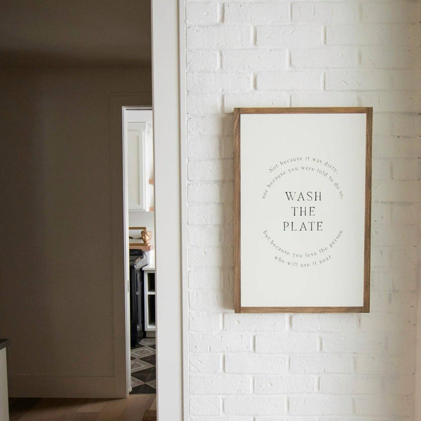 Wash the Plate | Wall Art: Soft White-Black Text / Light Brown Frame / 8 inches x 12 inches