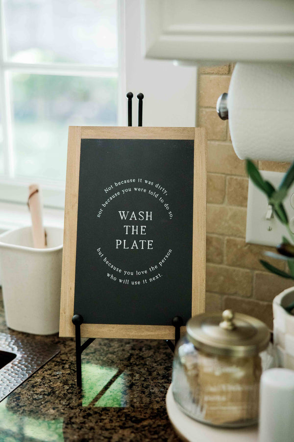 Wash the Plate | Wall Art: Soft White-Black Text / Light Brown Frame / 8 inches x 12 inches