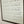 Love them Anyway | Mother Teresa | Wall Art: Soft White-Black Text / Light Brown Frame / 8 inches x 12 inches